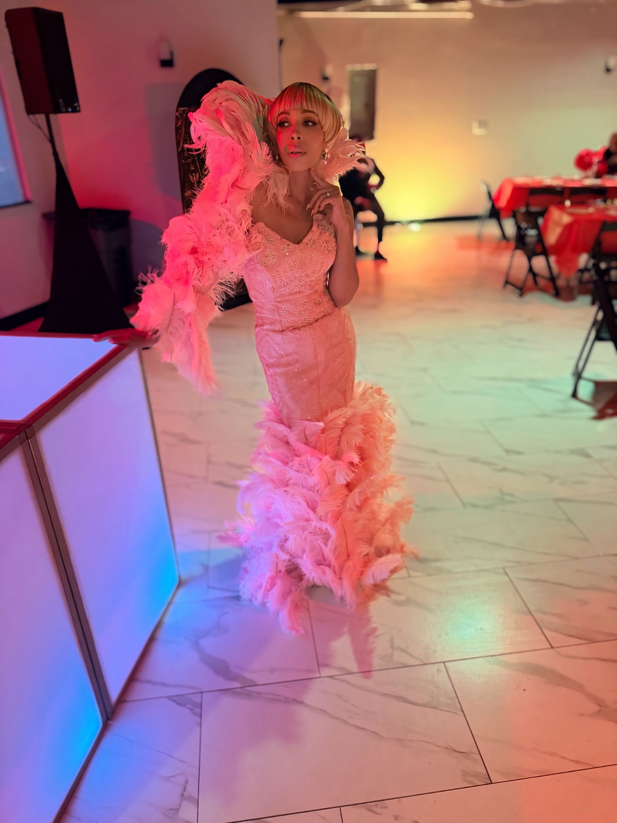 First-time ballroom entrant in a custom feathered look